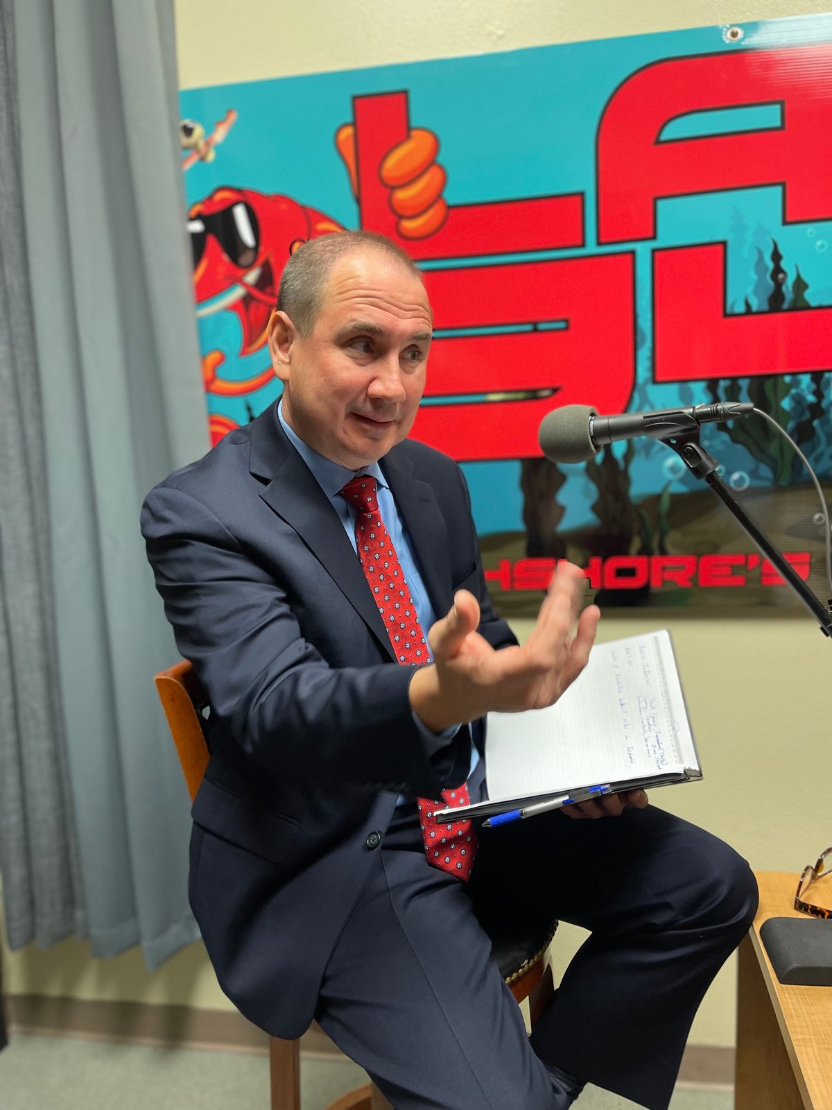 Rene recording a podcast